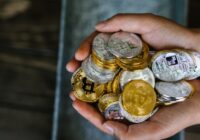A close-up of hands holding various cryptocurrency coins, representing digital finance. - A close-up of hands holding various cryptocurrency coins, representing digital finance., tags: di con - pexel